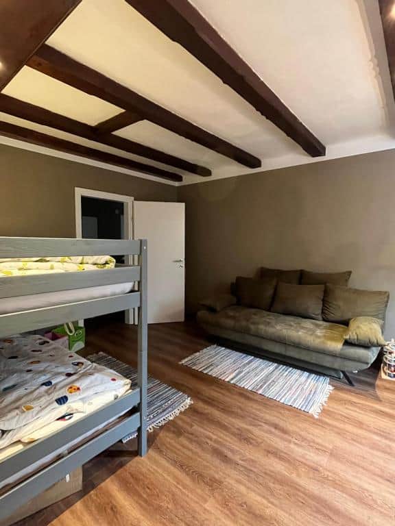Bedroom with a sofa bed and a bunk bed