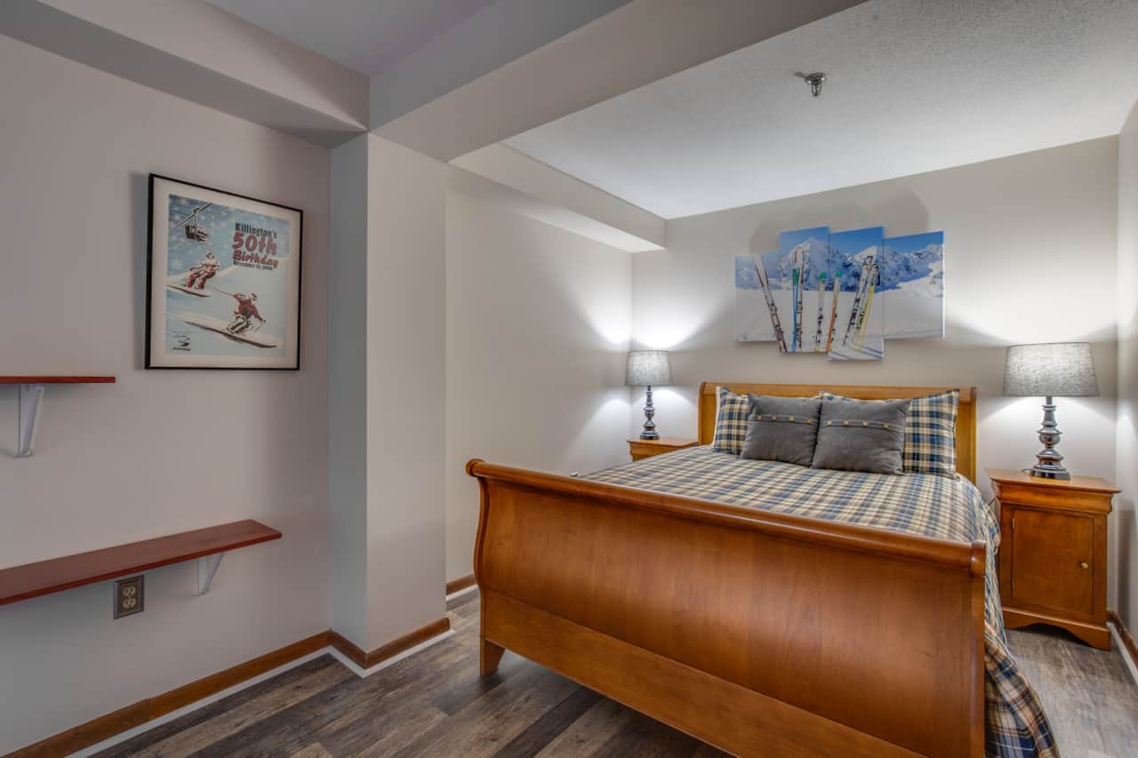 Bedroom features a comfortable queen bed , ample storage as well as a smart TV