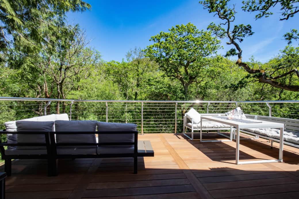 Outdoor dining and living area amongst the Tree canopies