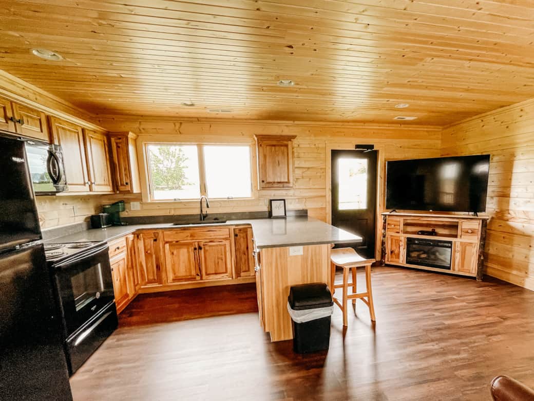 Full kitchen and living area in The Bear Cabin