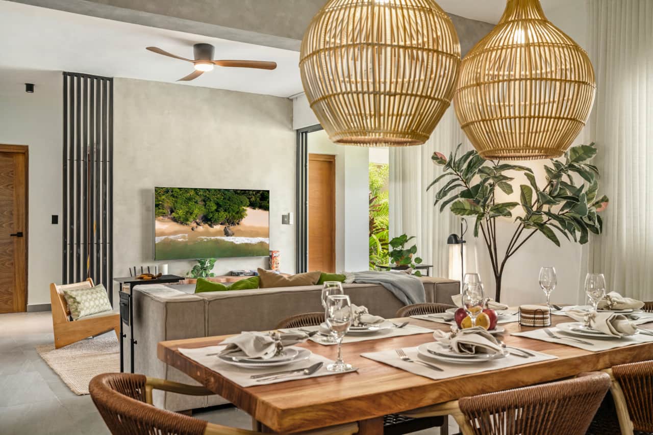 Spacious living room that opens up to pool-side terrace