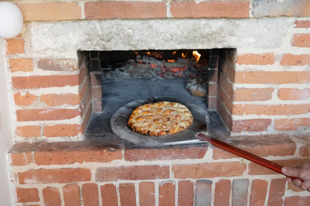 Indoor wood-fired oven for private pizza evenings with a local pizzaiolo on request