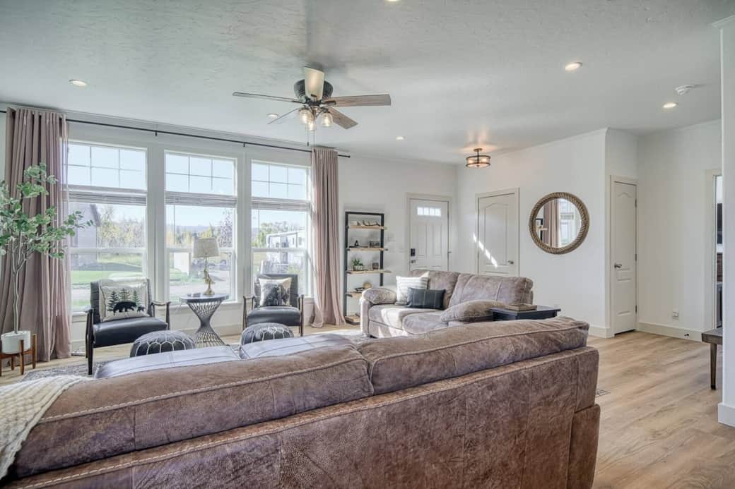 Light and airy, this beautiful living room has comfortable furniture with decor and style you will love! It's a perfect place for making memories with your family and friends! Light and airy, this beautiful living room has comfortable furniture with decor and style you will love! It's a perfect place for making memories with your family and friends!