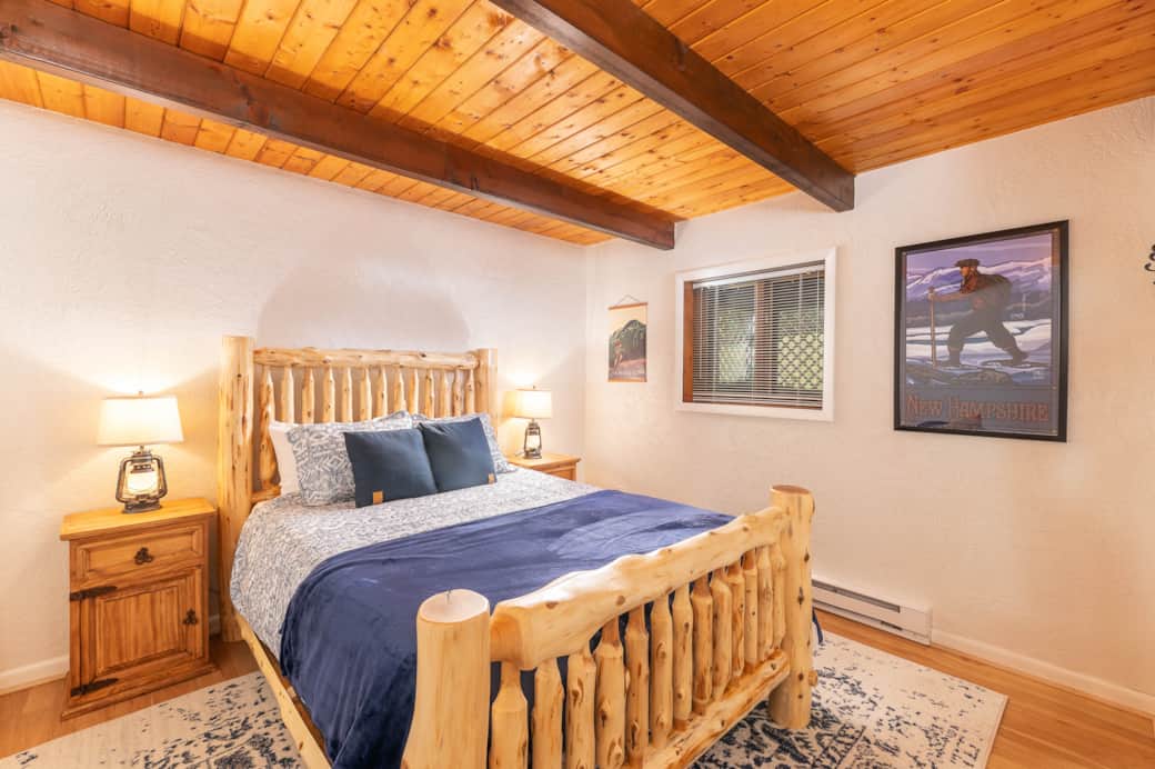 A large main bedroom has a queen bed and plenty of space.