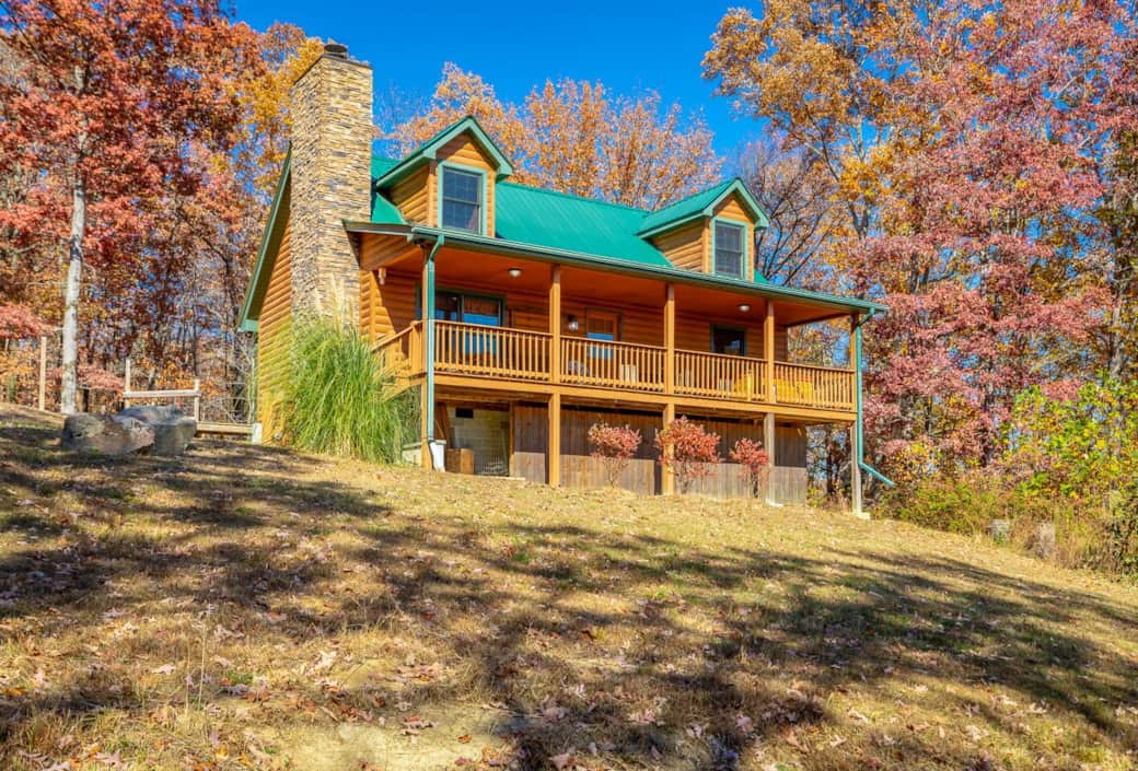 The view of the front of the cabin, the balcony has access to firewood and the hot tub. 