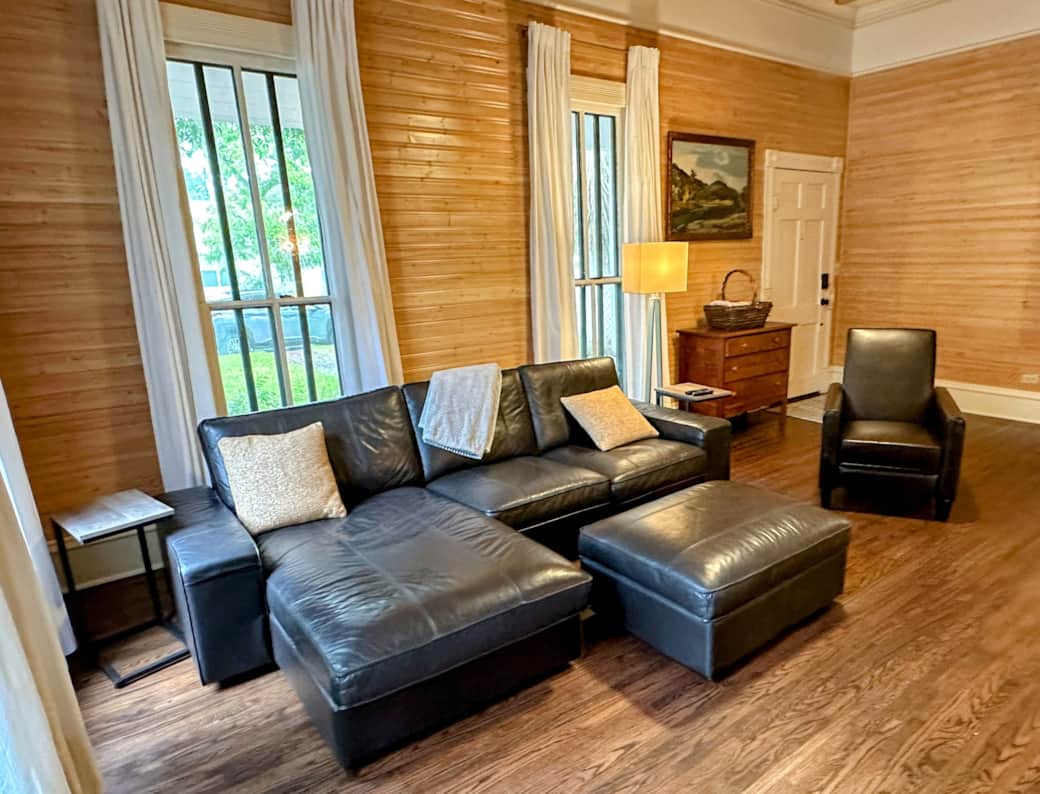 Spacious living room with comfortable seating and a large Roku TV. Spacious living room with comfortable seating and a large Roku TV.