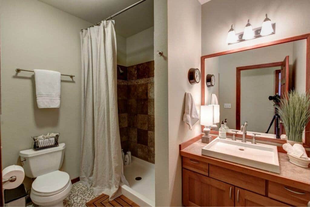 Travertine in double showerhead bathroom