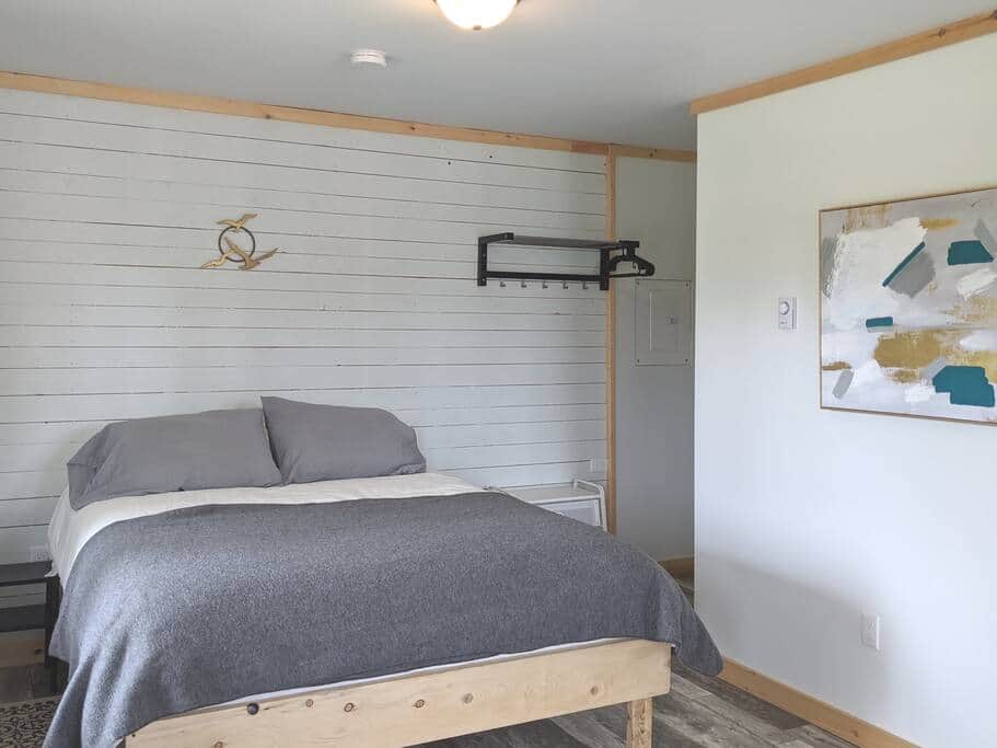  An inviting queen bed in the newly renovated Aurora cabin 
