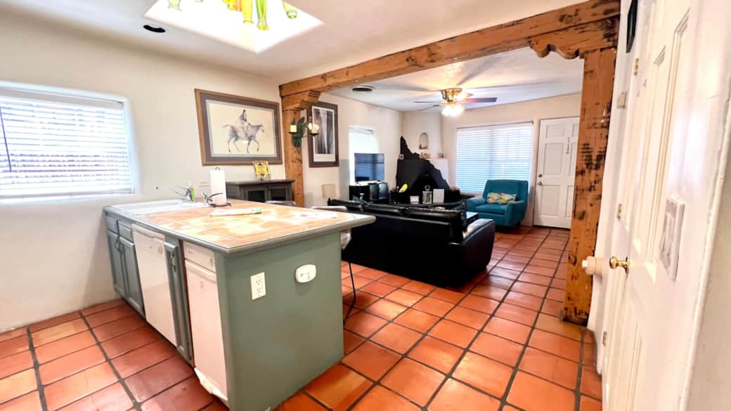 Kitchen and den spill into one anther