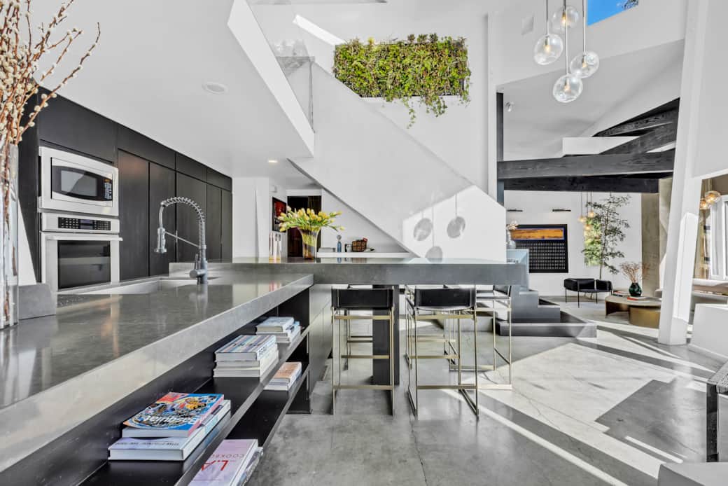 Savor the charm of our kitchen, featuring modern appliances and a cozy dining counter.