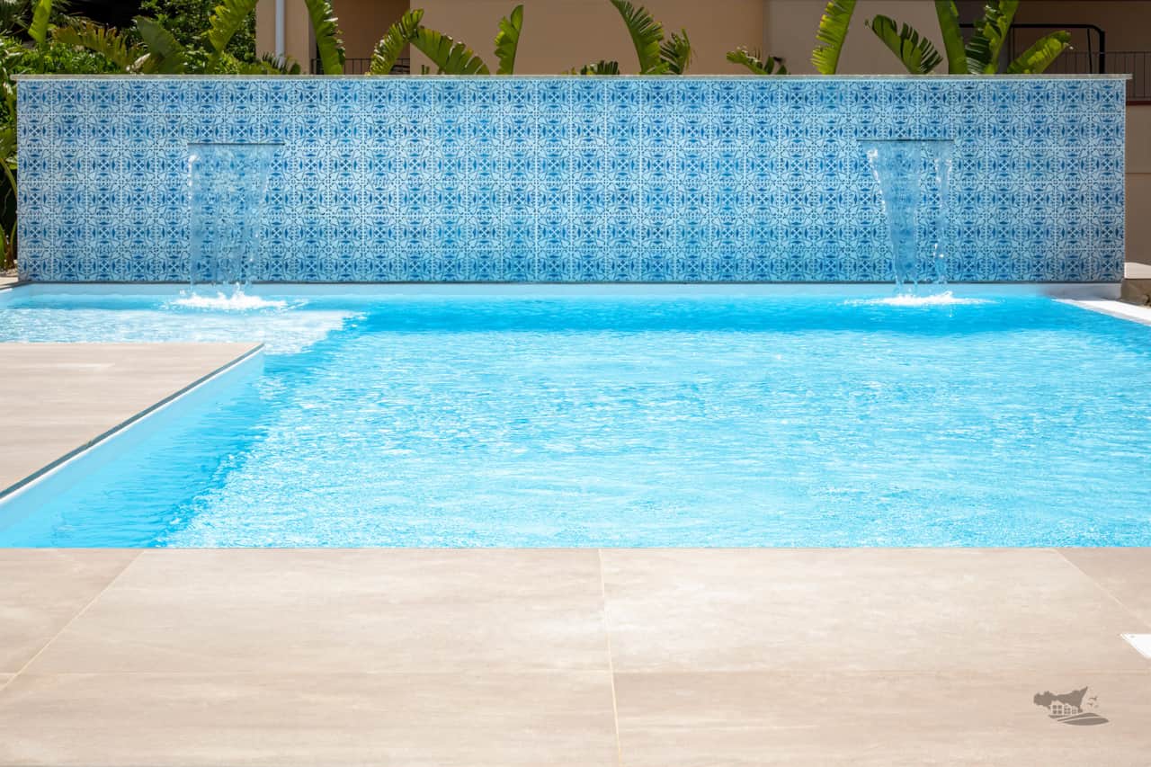 The stunning infinity pool with elegant cascading waterfalls.