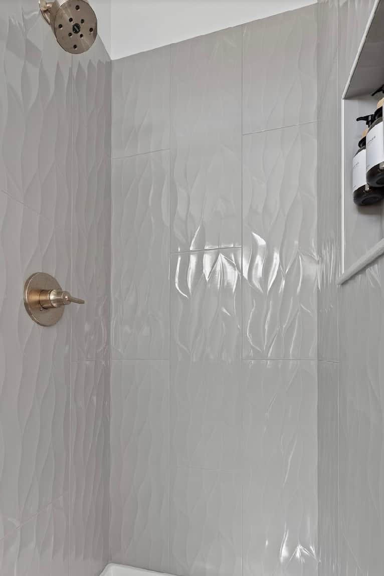Modern shower in bathroom connected to Bedroom 1