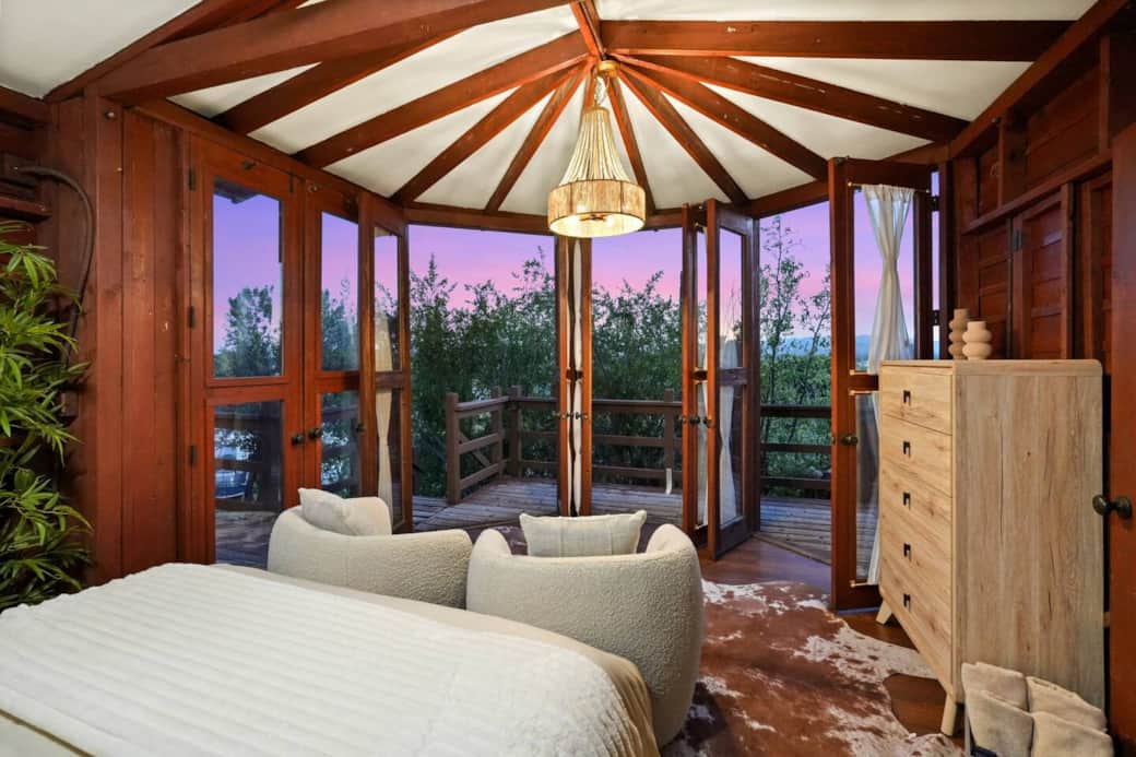 Glass doors provide fresh air and private deck access for a seamless indoor-outdoor experience. Glass doors provide fresh air and private deck access for a seamless indoor-outdoor experience.