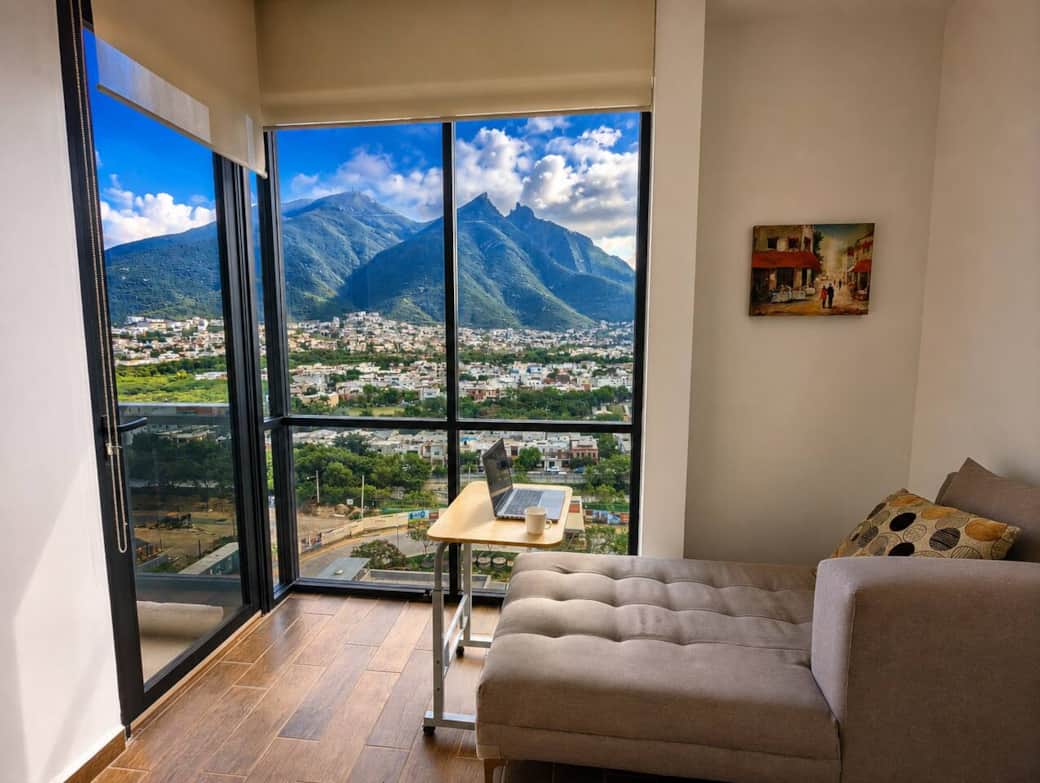 Cozy lounge nook with a comfortable seat, and inspiring mountain views through floor-to-ceiling windows. A bright, scenic Cerro de la Silla space ideal for working, relaxing, or enjoying Monterrey’s iconic landscape. Cozy lounge nook with a comfortable seat, and inspiring mountain views through floor-to-ceiling windows. A bright, scenic Cerro de la Silla space ideal for working, relaxing, or enjoying Monterrey’s iconic landscape.