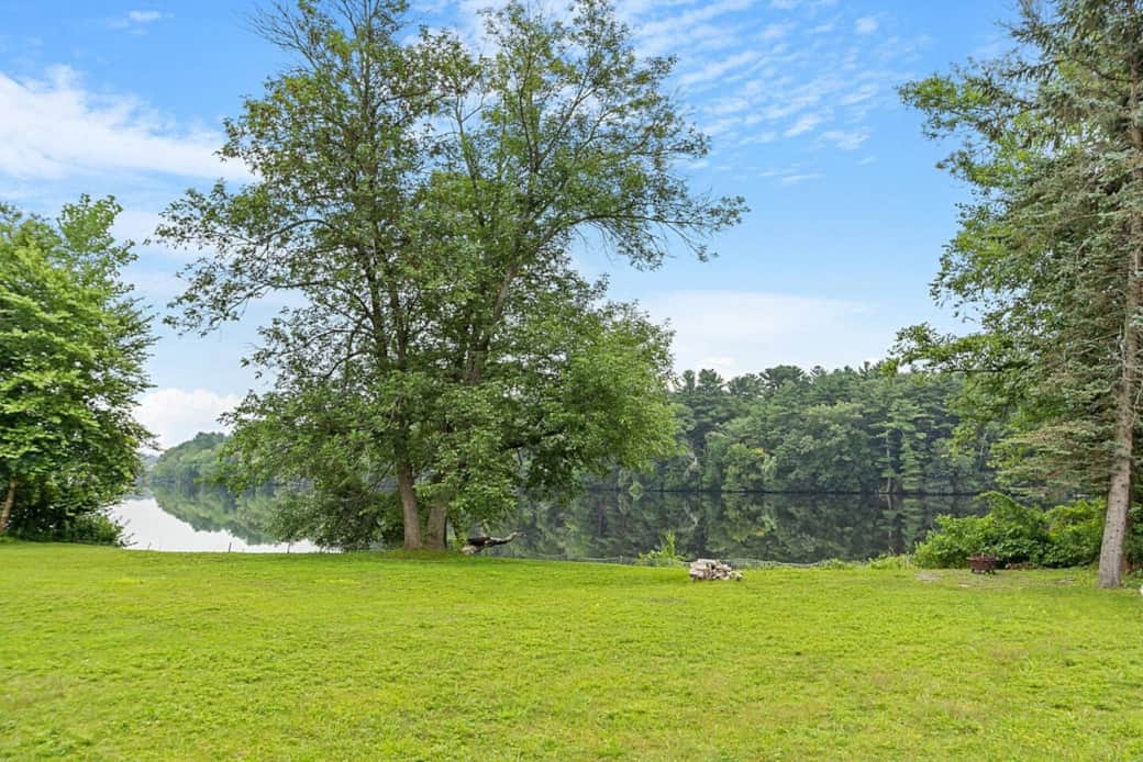 Back yard rolls down to the Merrimack River. The back of the house enjoys wonderful views. Back yard rolls down to the Merrimack River. The back of the house enjoys wonderful views.
