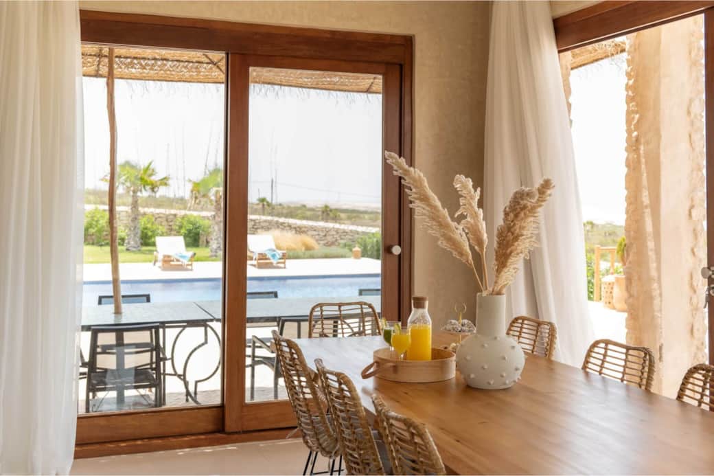 Living room dining table pool view