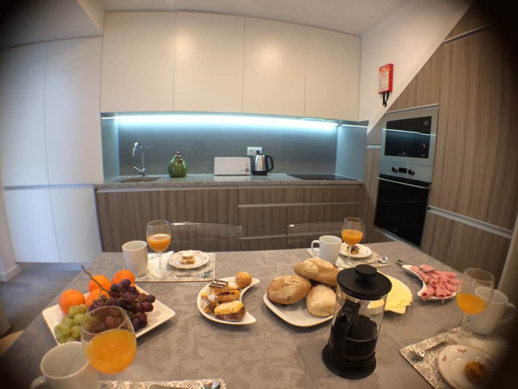Enjoy a leisurely breakfast at the dining table before heading out to explore Porto.