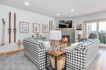 The fireplace centers the living room, offering a cozy ambiance as you relax. The fireplace centers the living room, offering a cozy ambiance as you relax.