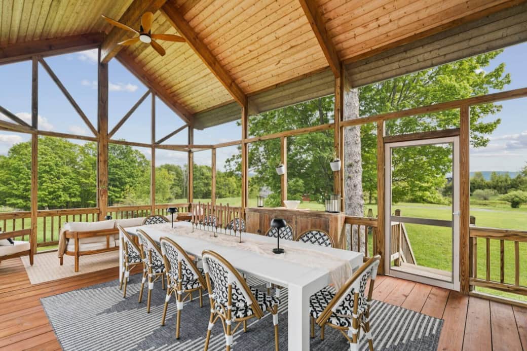 Screened in, covered outdoor dining area comfortably seats 12.