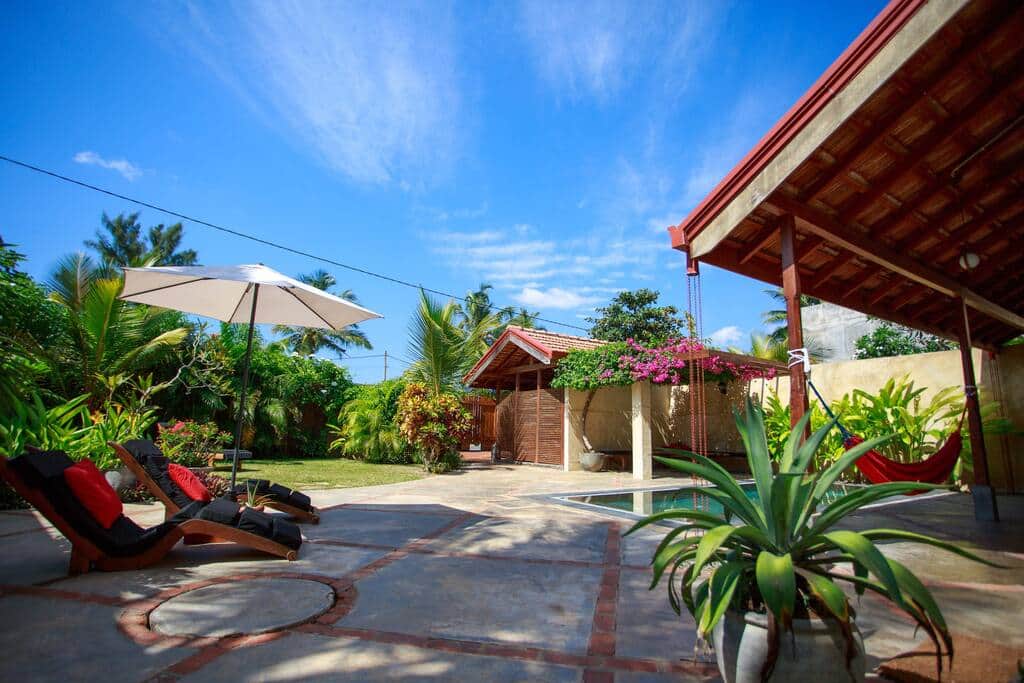 Villa garden space on Villa Ebb. Flow has a large Frangipani tree providing shade