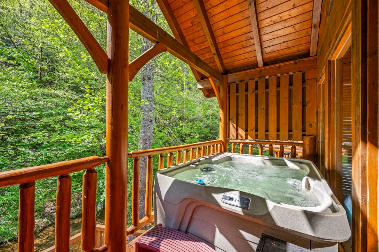 Hot tub bliss with creekside views—nature’s perfect relaxation spot