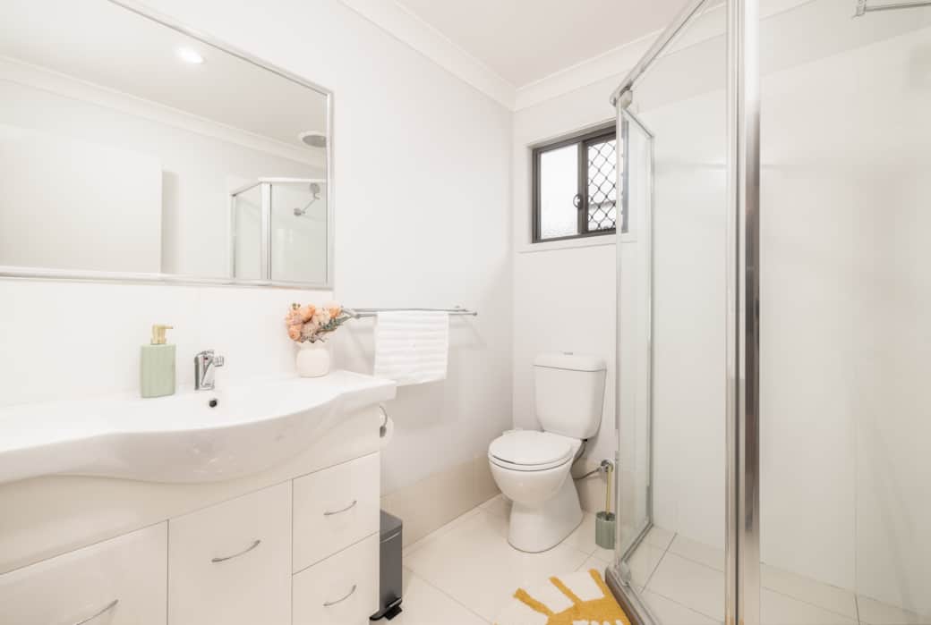 Bathroom: Stylish bathroom with walk-in shower, vanity, and clean finishes 