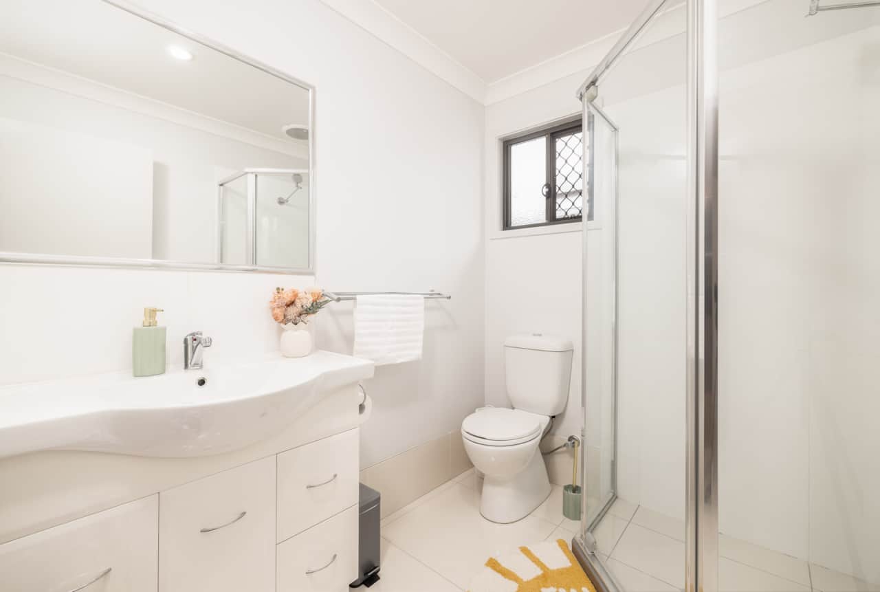Bathroom: Stylish bathroom with walk-in shower, vanity, and clean finishes 