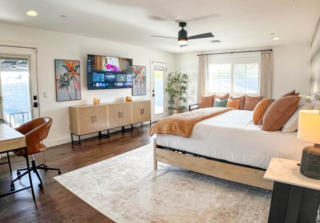 You will love the large primary king suite in a separate wing with doors to the patio and hot tub, paired with a 65″ smart TV, warm, calming, and designed to help you fully unwind. 