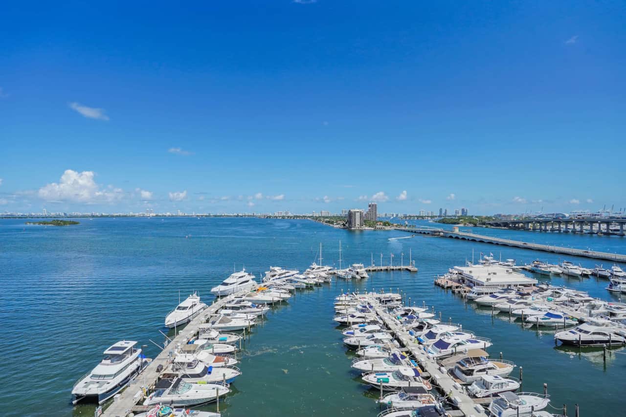 Private furnished balcony with views of Biscayne Bay, Venetian Marina, Port of Miami, Miami Beach