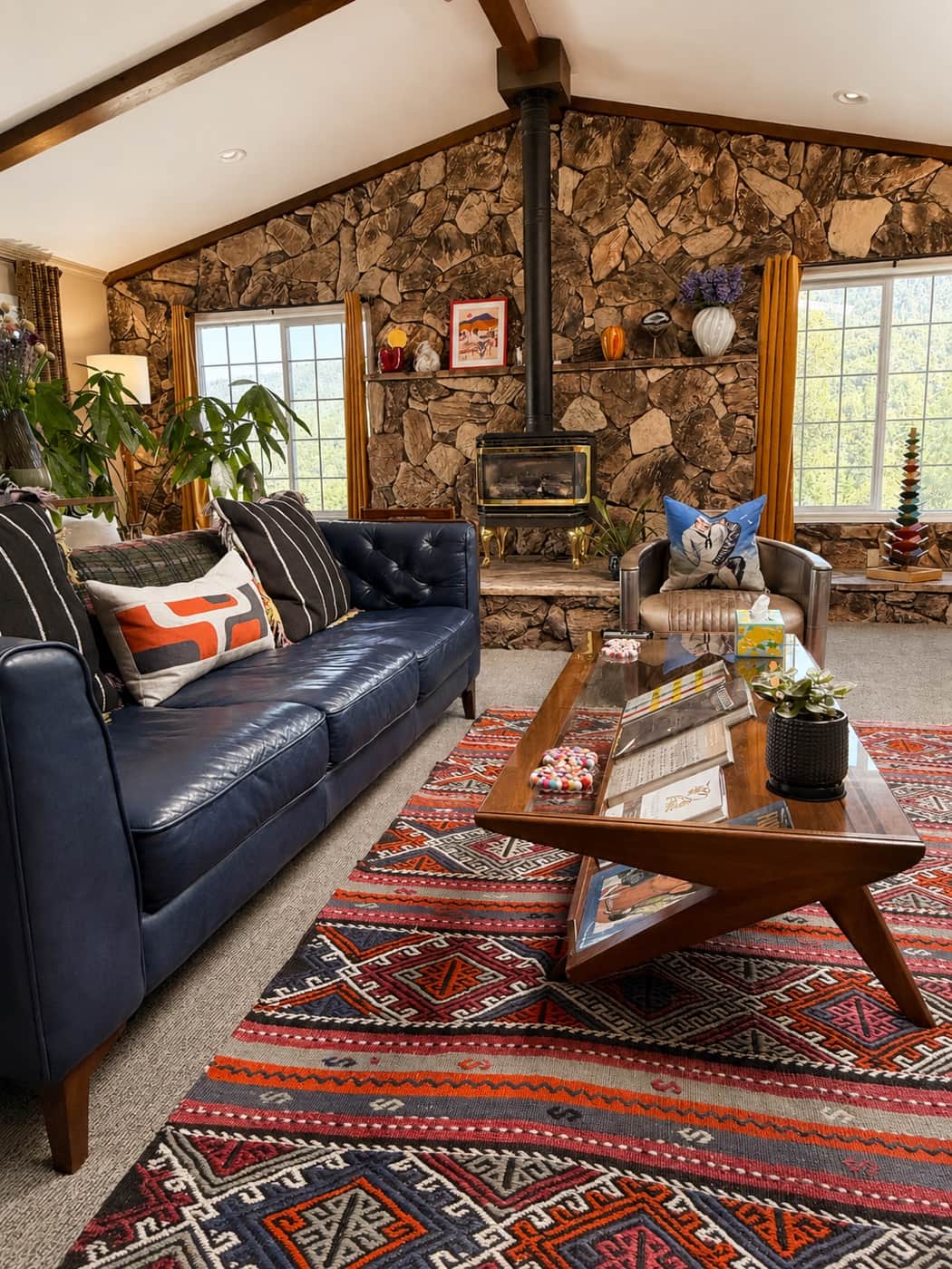 Cozy Mountain Daddies living room with a stone fireplace and comfortable seating