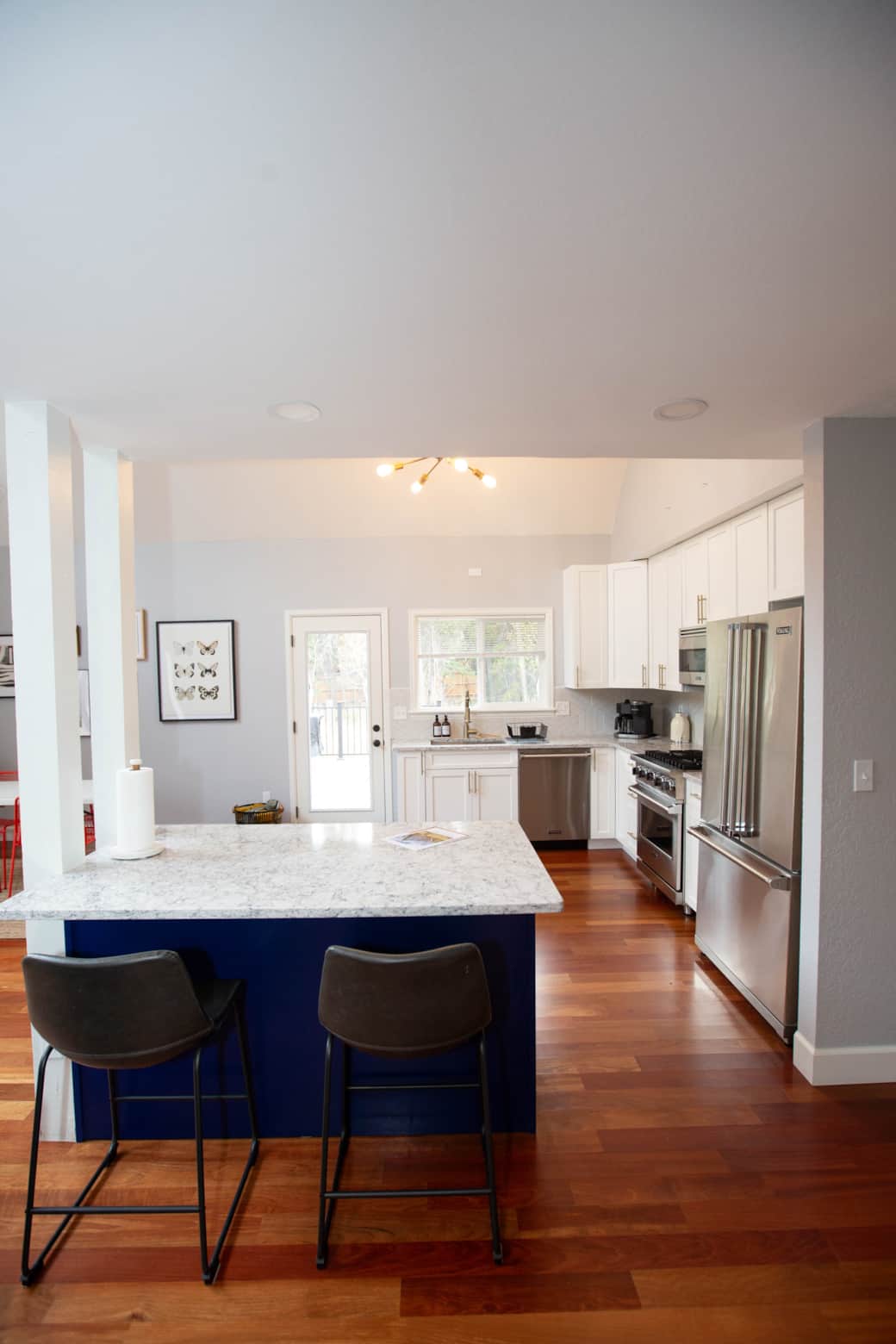 Kitchen island and peek into the back deck/yard Kitchen island and peek into the back deck/yard