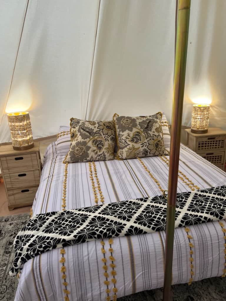Inside Yurt, bed with sidetables