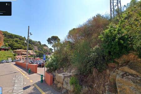 Entrance of the parking of sa tuna's beach