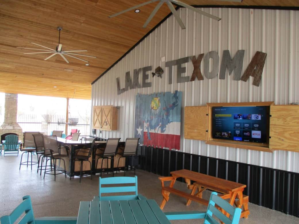 Pavilion area with two big screen TVs, bar for socializing, grill, board games and a cozy fireplace. Pavilion area with two big screen TVs, bar for socializing, grill, board games and a cozy fireplace.