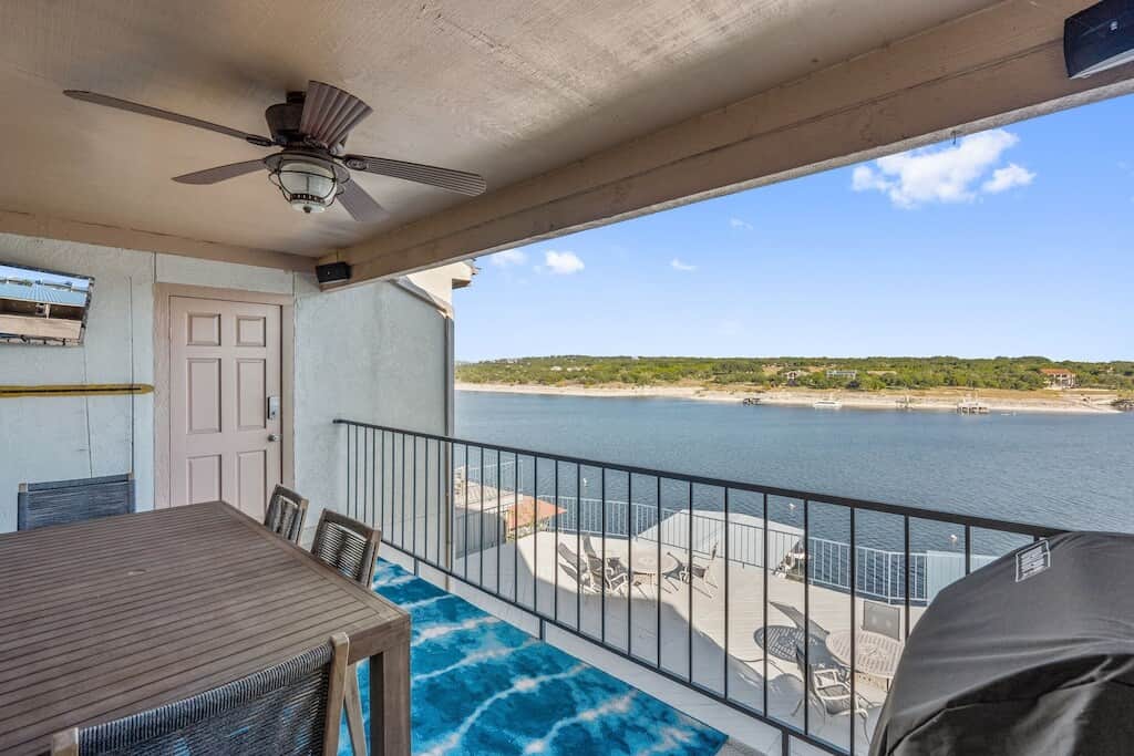 Covered patio with outdoor dining and propane grill.