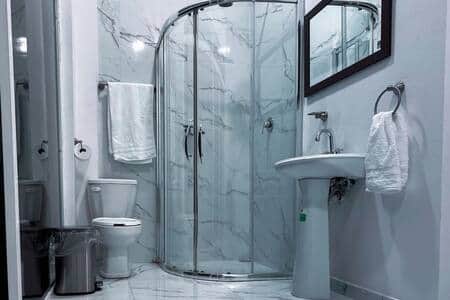 Shower: Clean and updated shower in the private ensuite bathroom for a refreshing experience.