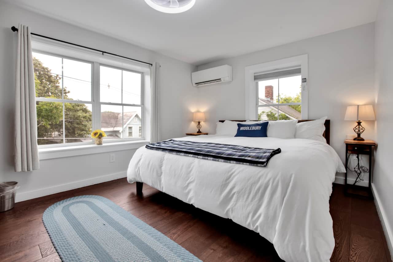 Brand new king bed waits for you in this beautiful master bedroom with maple dresser
