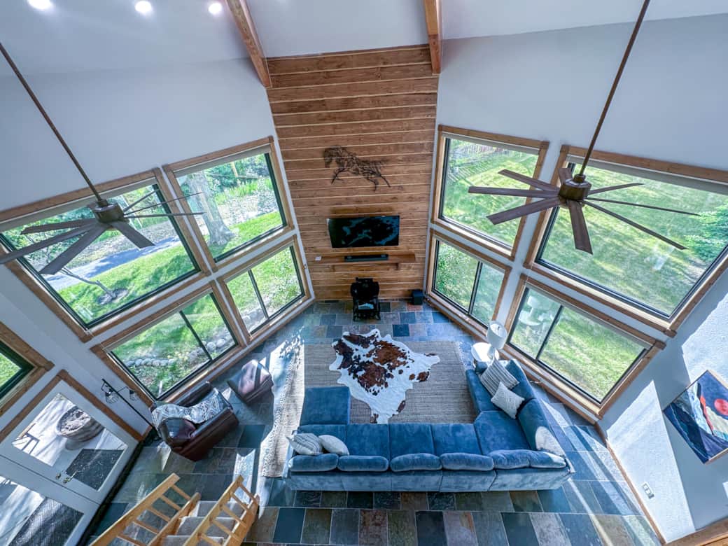 View from the top of the spiral staircase looking down into the living room