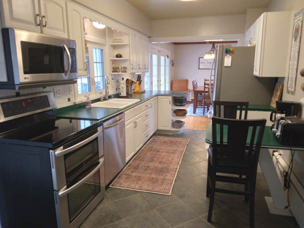 Full kitchen with stainless steel appliances and basic cooking essentials Full kitchen with stainless steel appliances and basic cooking essentials