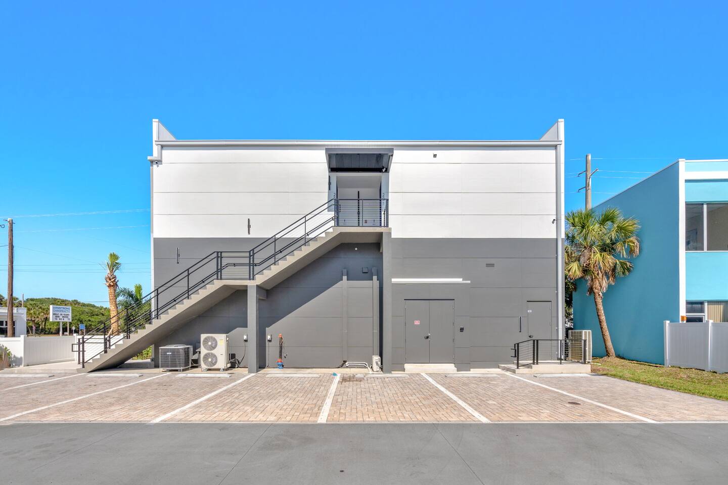Modern exterior with private entry and convenient parking.