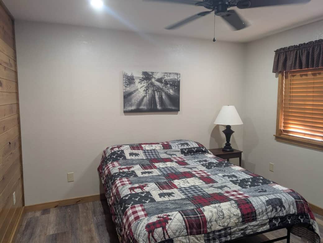 Both bedrooms have a bedside table and lamp. 