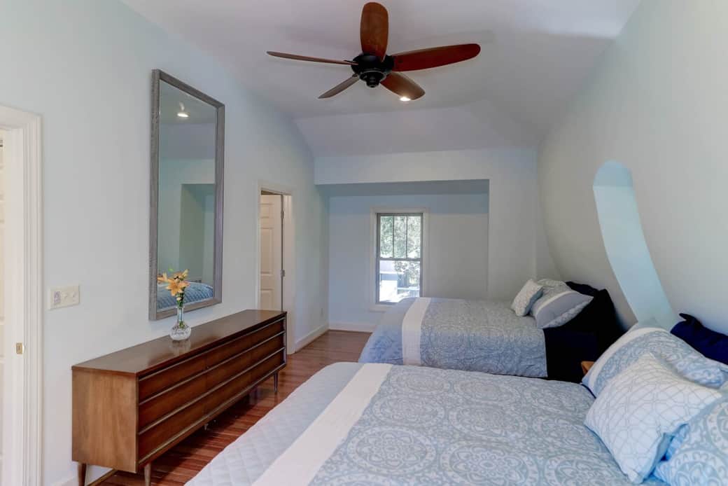 25 X 12 bedroom with two queen beds adjoining bath and laundry