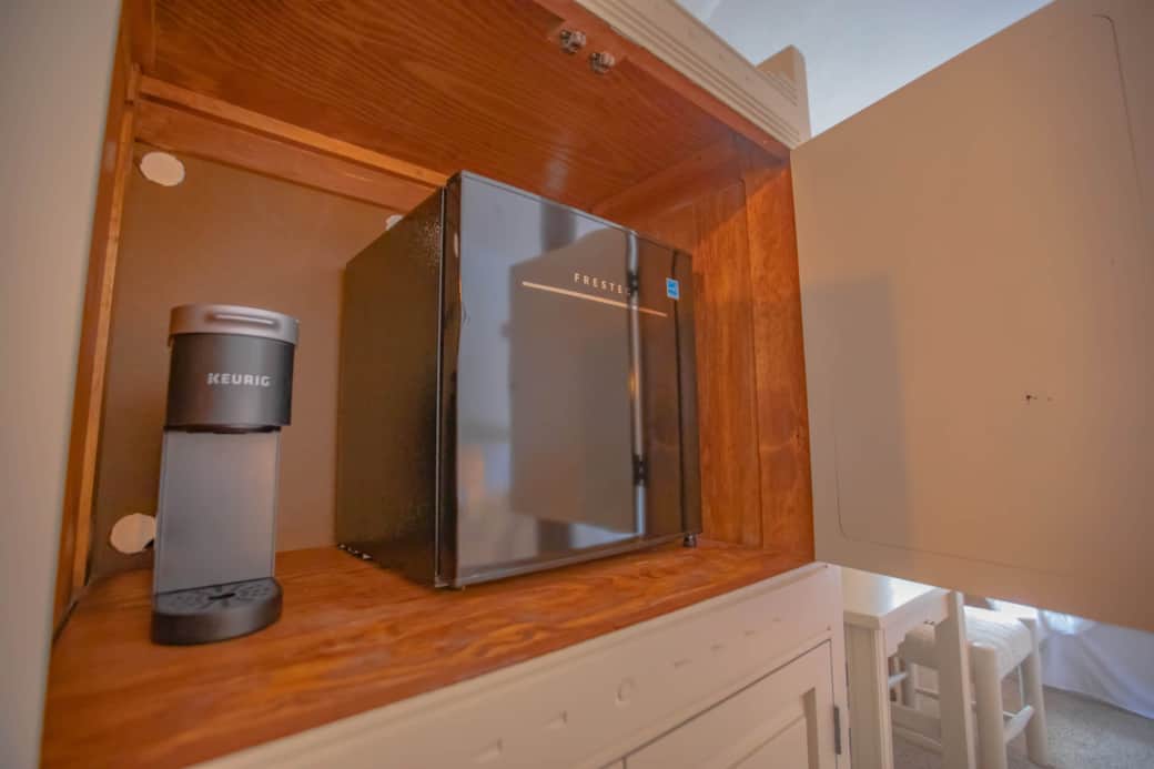 Coffee machine and mini fridge. Coffee machine and mini fridge.