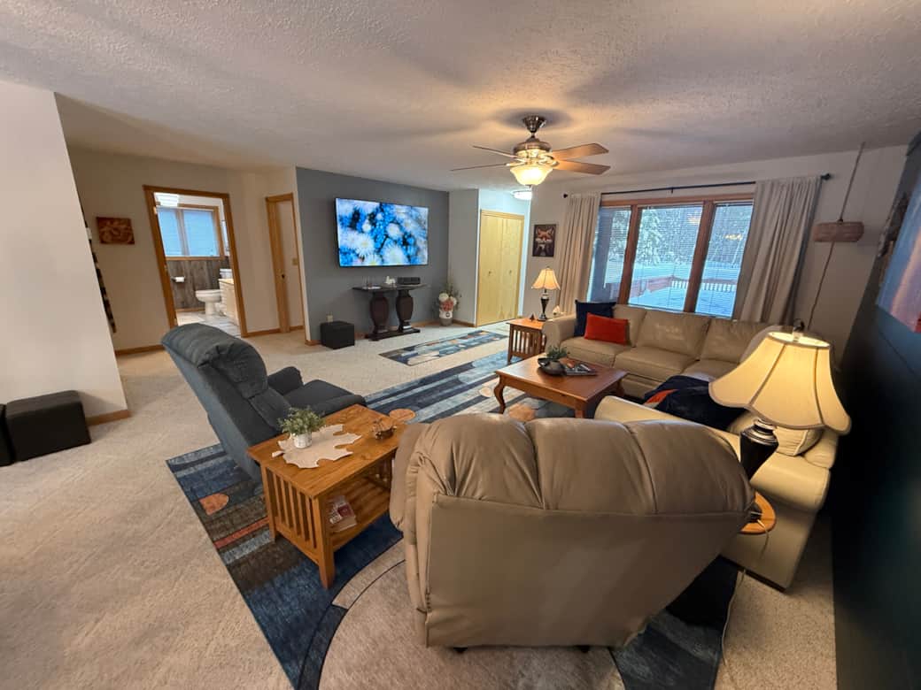 Family room with 75" TV easily seen from kitchen Family room with 75" TV easily seen from kitchen