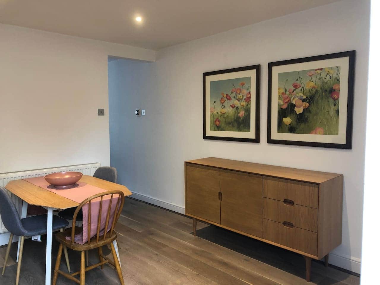 Dining room with storage available in the sideboard. 