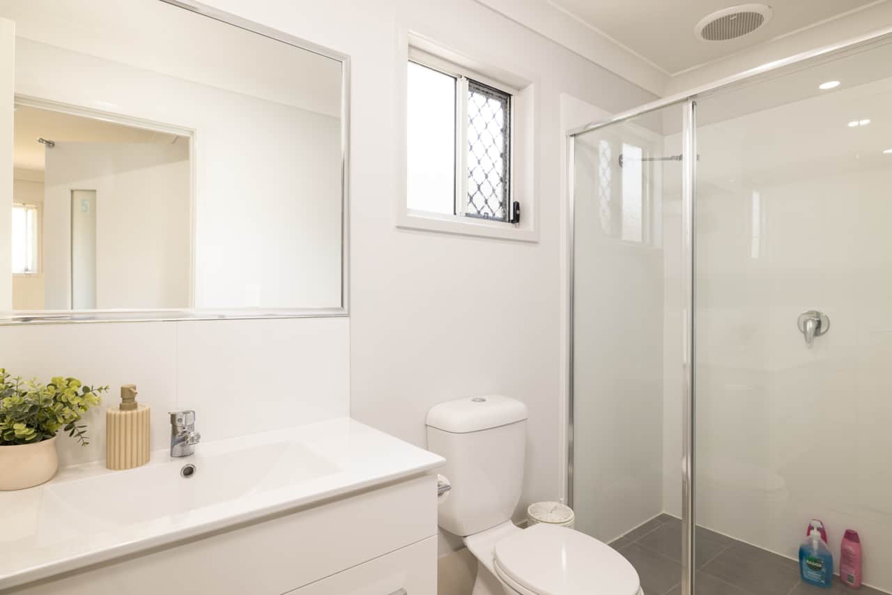 Bathroom: Stylish bathroom with walk-in shower, vanity, and clean finishes 