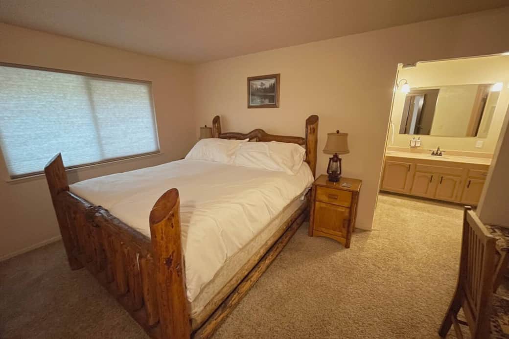 The primary bedroom has it's own attached full bathroom, a spacious king bed, and a dedicated work area. All nightstands have  outlets to charge your devices nearby while you sleep.