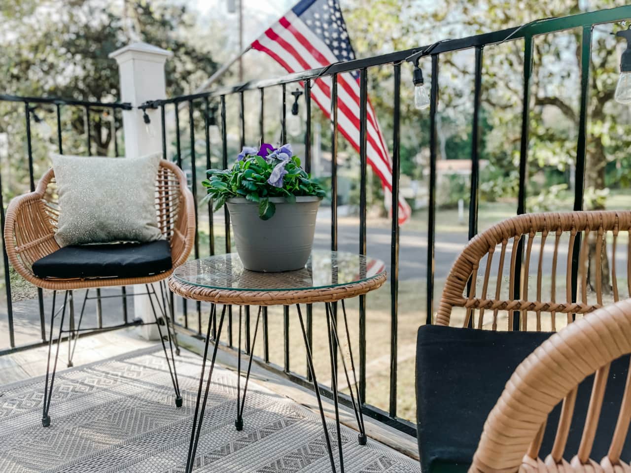 Balcony has string lights, vistas of Magnolia River and lush live oak canopies.