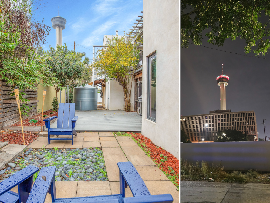 View of the backyard with the Tower of the Americas lit up at night. 