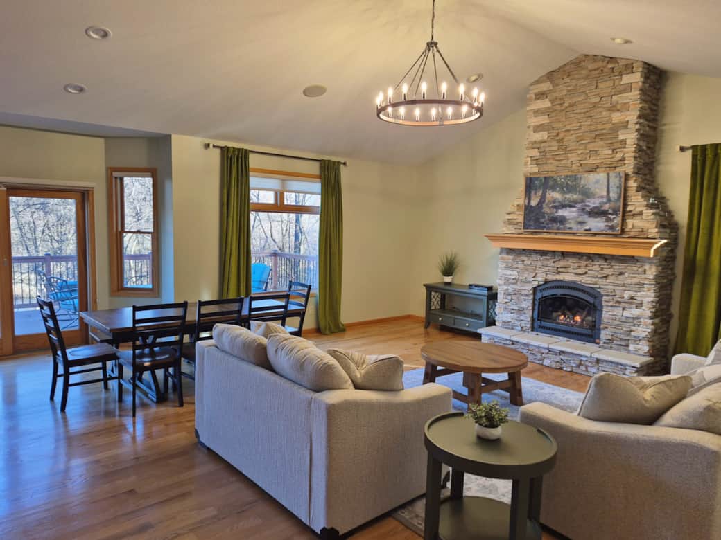 The open concept great room is a perfect place to gather, cook meals, and enjoy river views.
